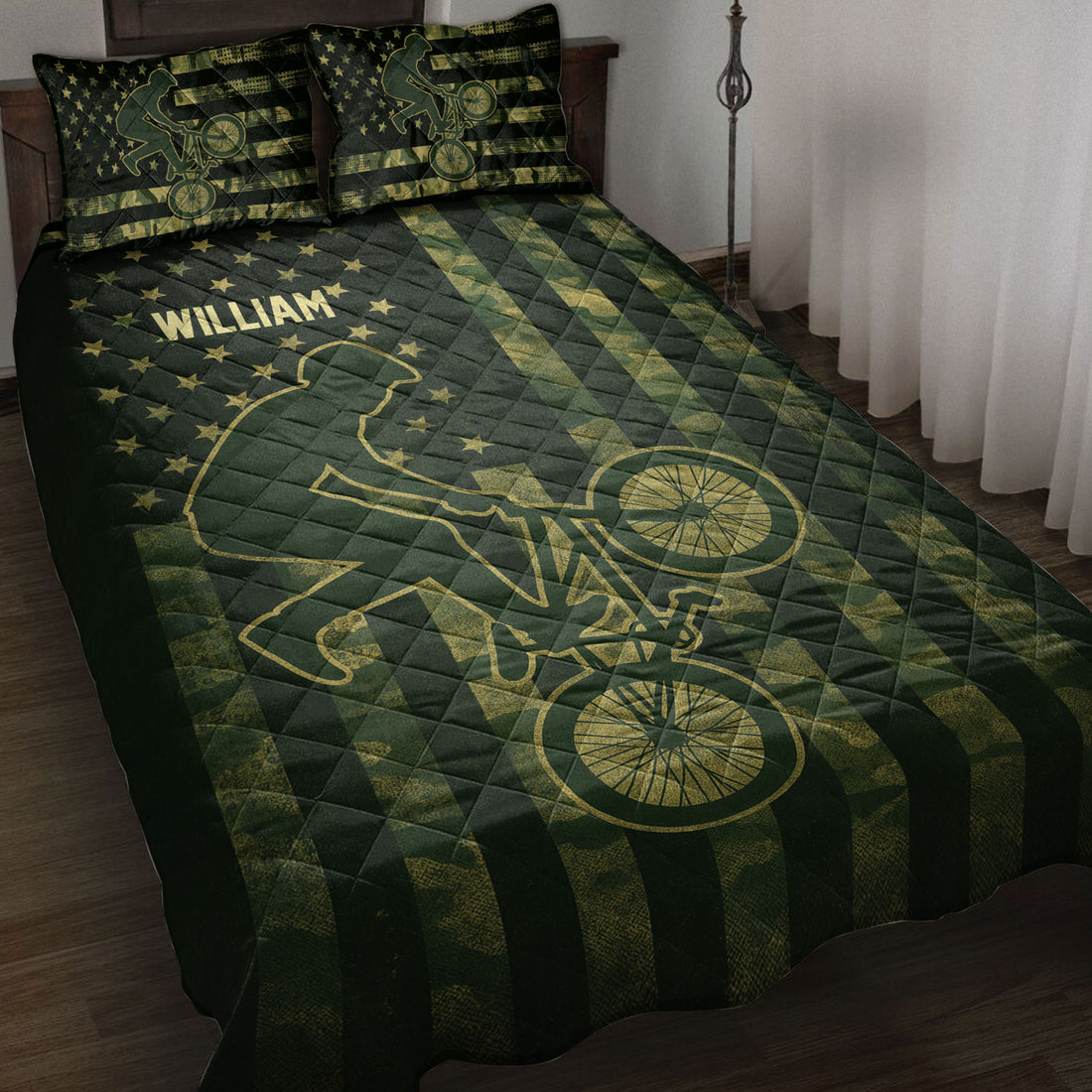 BMX rider and bicycle artwork on a dark green and gold quilt blanket in a bedroom