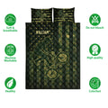 BMX quilt bedding displayed with dark green and gold bicycle artwork and star details