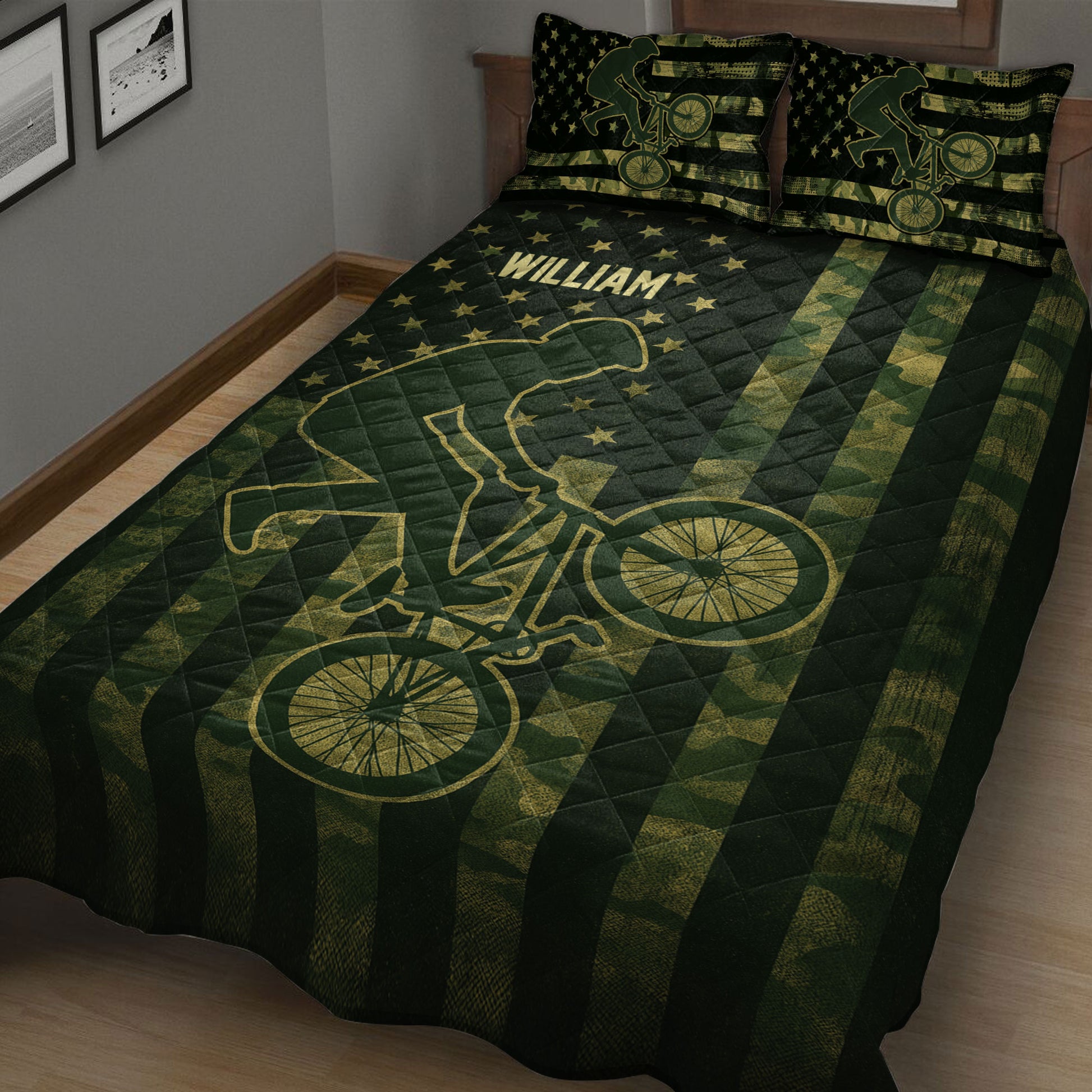 Close bedroom view of a dark BMX quilt with bicycle wheels, rider artwork and star accents