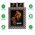 BMX quilt bedding set featuring orange rider artwork, black quilted center, and checkerboard border