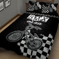 Close bedroom view of black BMX quilt blanket with bicycle graphics and checkerboard design