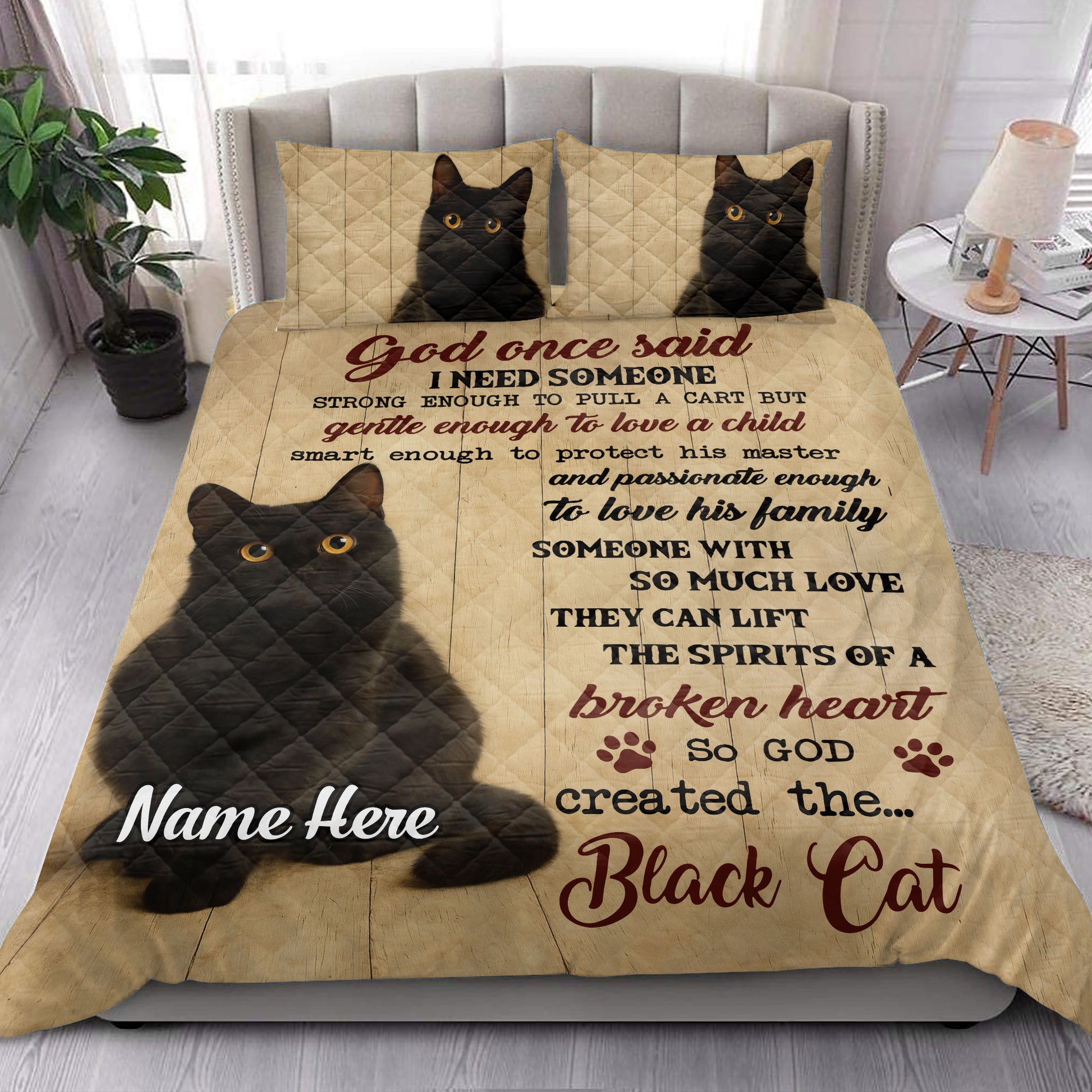 Black cat quilt bedding set styled on a bedroom bed with matching cat artwork and heartfelt design