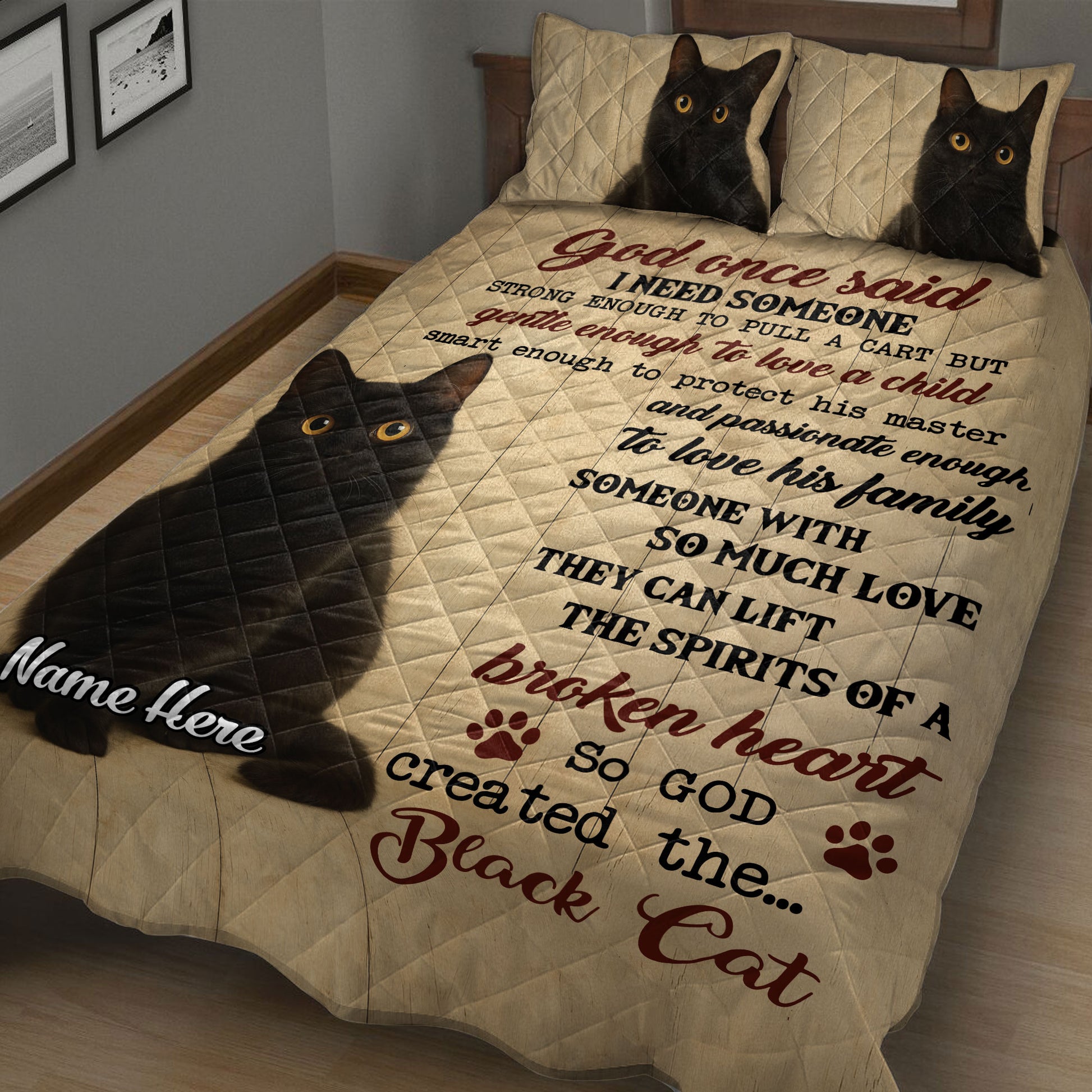 Angled bedroom view of a black cat quilt blanket with expressive cat portraits and sentimental artwork