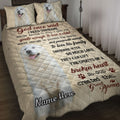 Great Pyrenees quilt blanket displayed on a bed with white dog portraits, paw prints, and heartfelt faith-inspired artwork