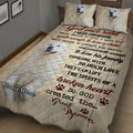 Great Pyrenees quilt bedding displayed at an angle with white dog portraits, paw prints, and cream and burgundy artwork