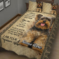 Close bedroom view of a Yorkshire Terrier quilt blanket with large dog portrait and ornate border