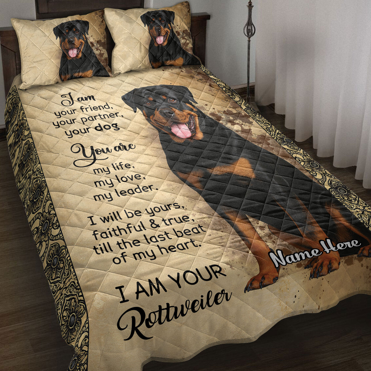 Rottweiler quilt blanket displayed on a bed with tan distressed artwork, ornate borders, and black-and-rust dog portraits