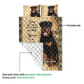 Rottweiler quilt blanket shown with a printed front, white reverse side, and full-body dog artwork