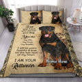 Rottweiler quilt bedding displayed in a bright bedroom with coordinated dog portrait pillow designs
