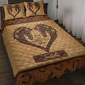 Rustic horse quilt blanket displayed on a bed with heart-shaped horse artwork and western horseshoe borders