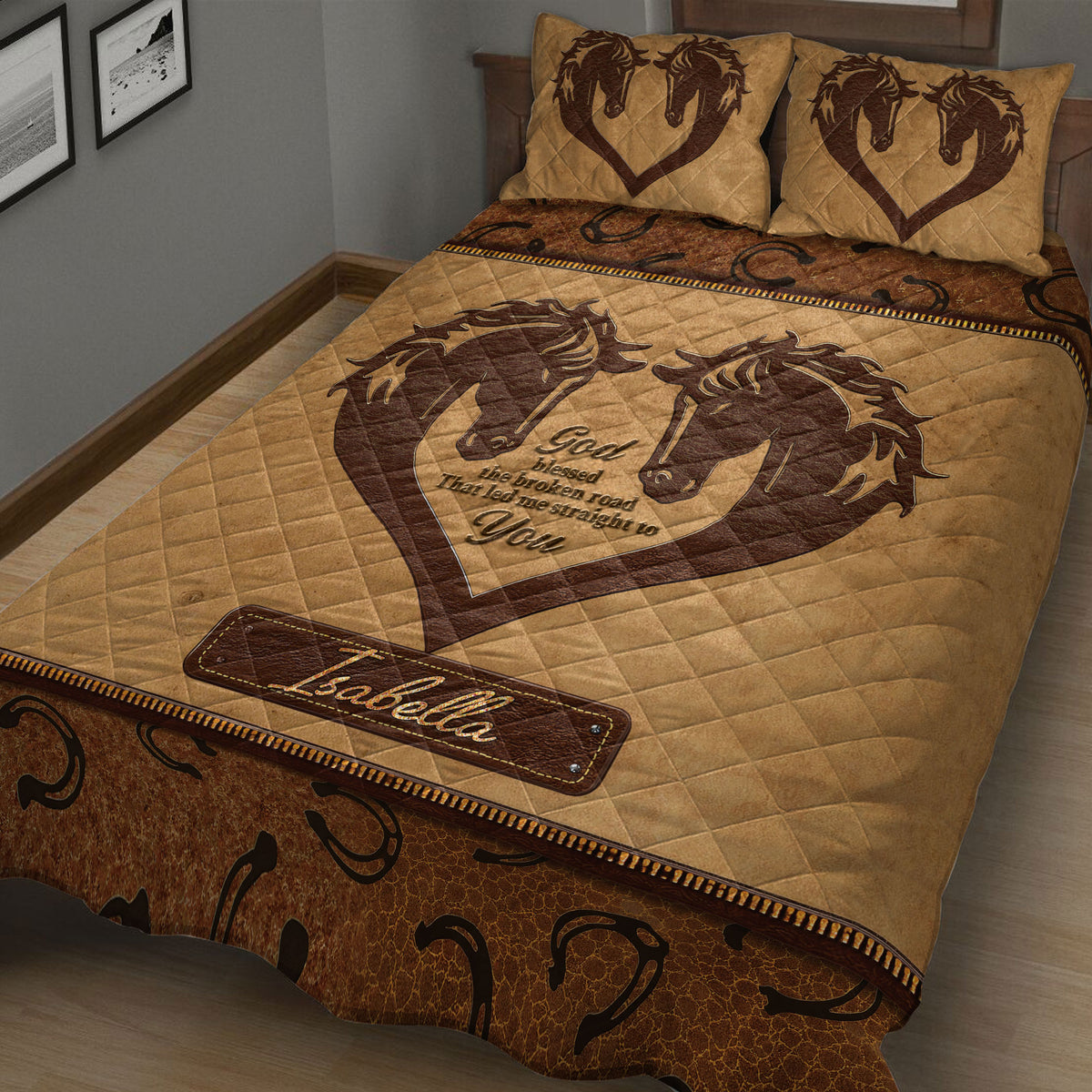 Close bedroom view of a brown horse quilt blanket featuring paired horses, horseshoes, and rustic western artwork