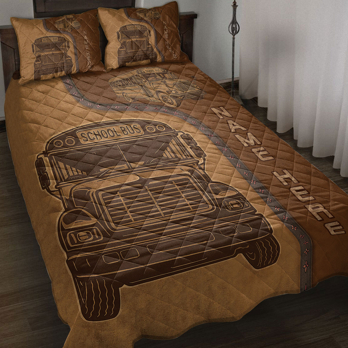 School bus driver quilt blanket spread across a bed with vintage bus artwork in warm brown tones