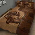 Brown school bus driver quilt spread across a bed with repeated bus illustrations and bold lettering