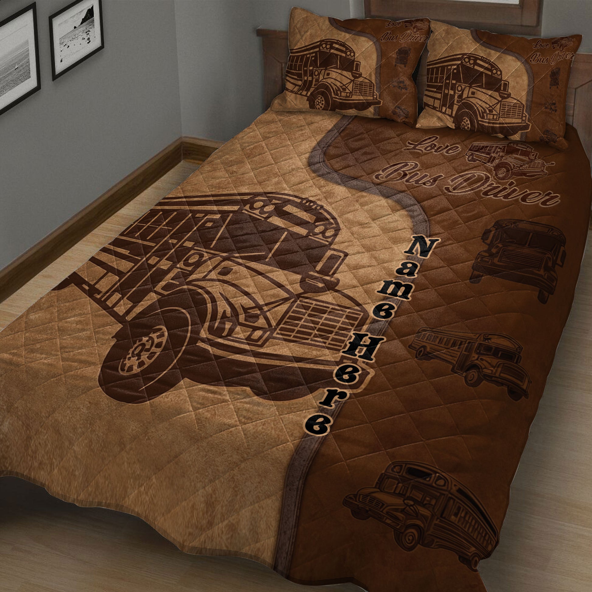 Brown school bus driver quilt spread across a bed with repeated bus illustrations and bold lettering