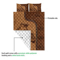 Dump truck quilt showing the printed front and white quilted backing