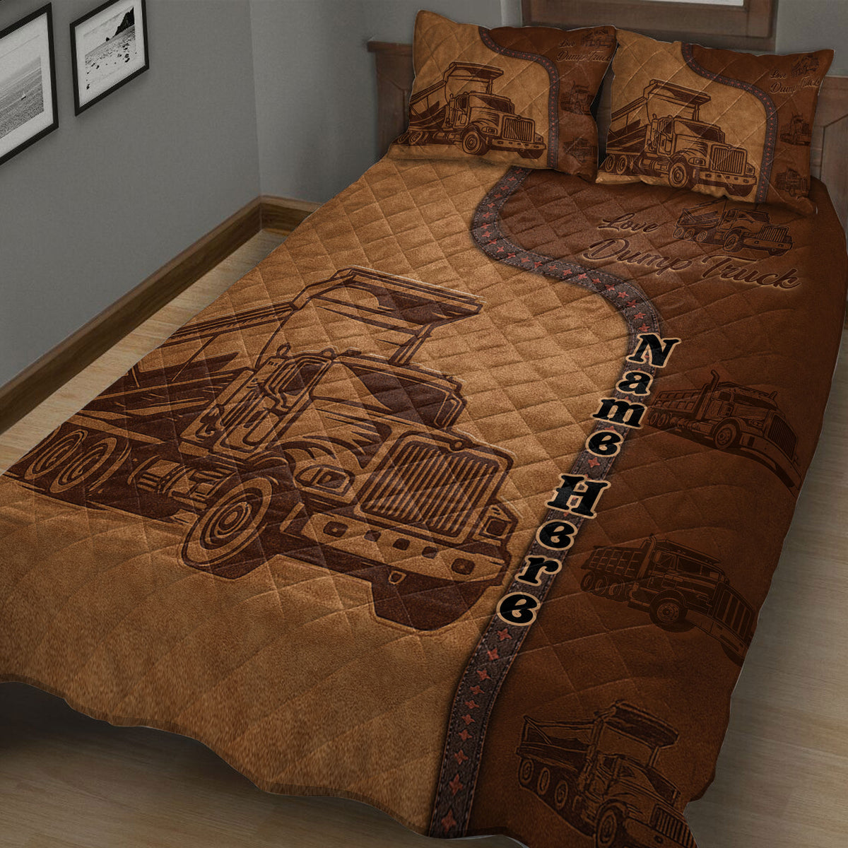 Close-up of brown quilt blanket featuring detailed dump truck illustrations and construction vehicle accents