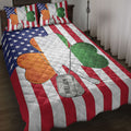Veteran quilt blanket displayed on a bed with American flag stripes, stars, colorful hearts, and dog tag artwork