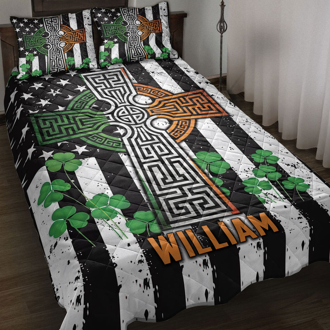 Irish Celtic cross quilt blanket displayed on a bed with shamrocks and black, white, green, and orange artwork