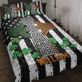 Irish Celtic cross quilt blanket displayed on a bed with shamrocks and black, white, green, and orange artwork