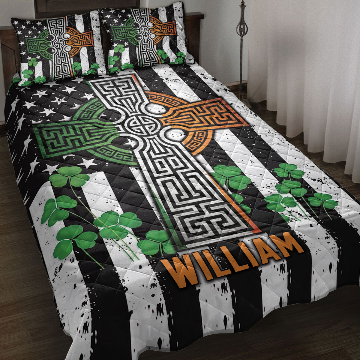 Irish Celtic cross quilt blanket displayed on a bed with shamrocks and black, white, green, and orange artwork