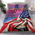 LGBT pride quilt blanket styled in a bright bedroom with rainbow colors, stars, and inclusive artwork