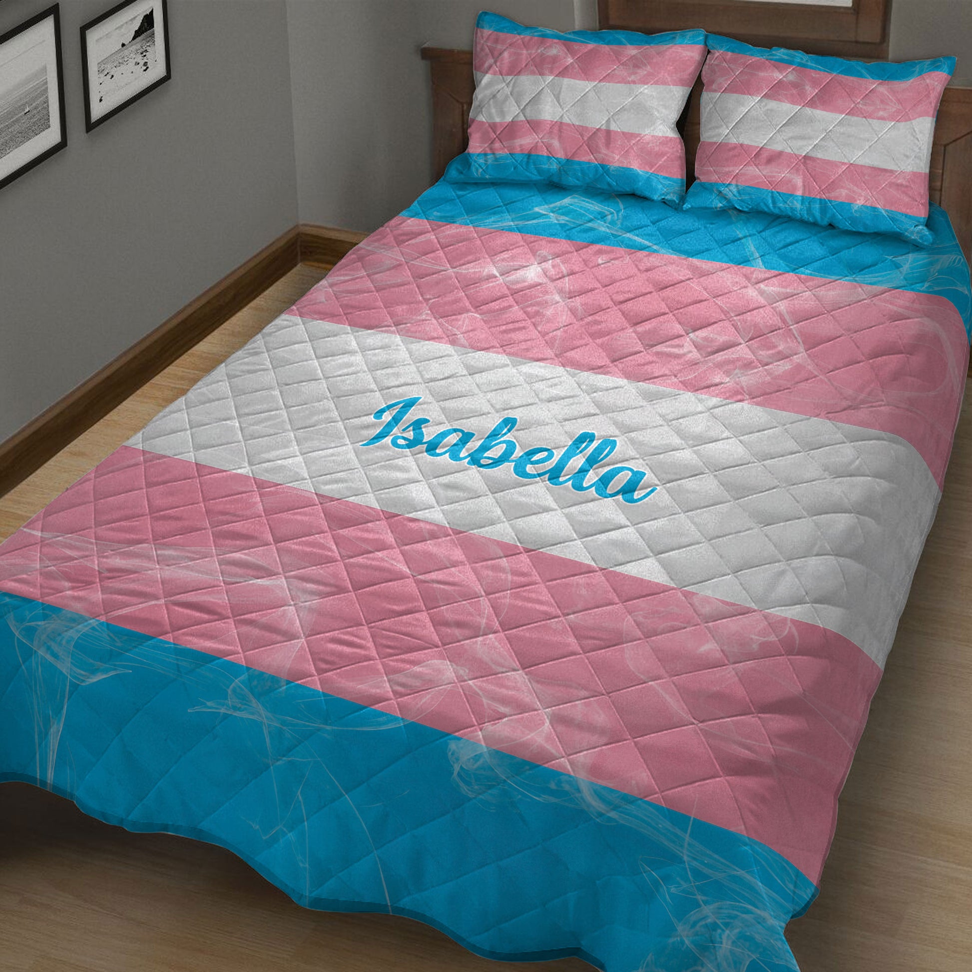 Angled bedroom view of a transgender pride quilt blanket with bold pink, white, and blue bands