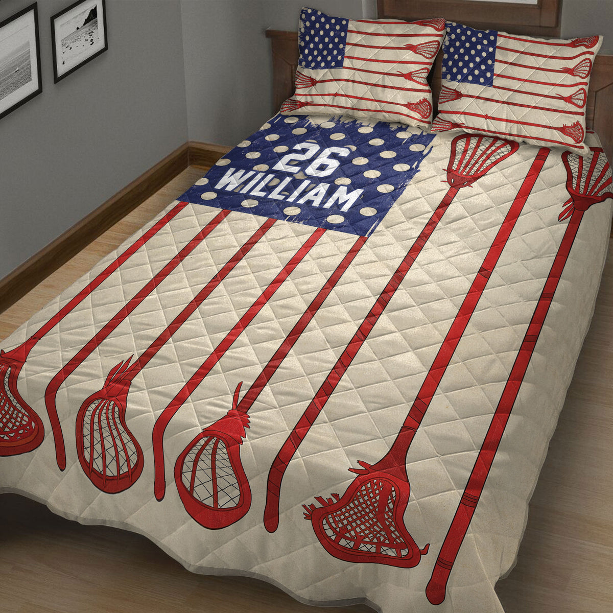 Close bedroom view of a lacrosse quilt blanket with red sticks and blue patterned sports artwork