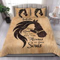 Horse-themed quilt blanket displayed in a bright bedroom with equestrian artwork and matching pillows