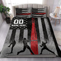 Baseball quilt blanket styled on a bedroom bed with baseball player silhouettes and distressed black, red, and gray stripes