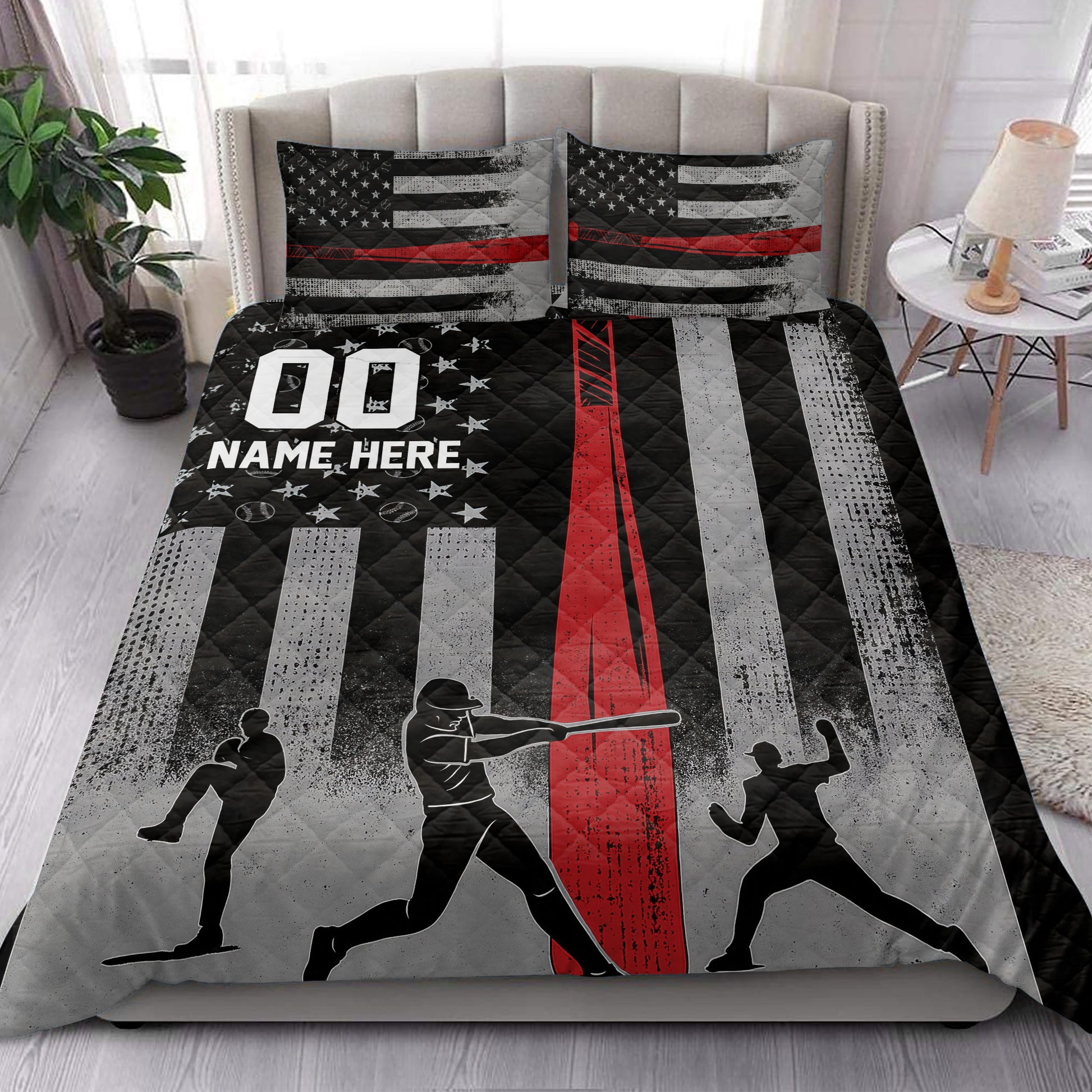 Baseball quilt blanket styled on a bedroom bed with baseball player silhouettes and distressed black, red, and gray stripes
