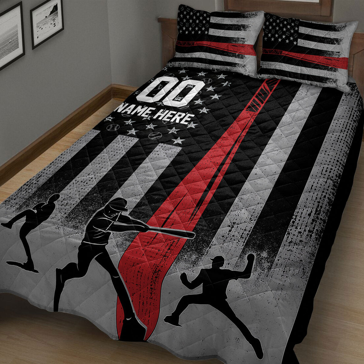 Close bedroom view of a baseball quilt blanket featuring batting silhouettes, baseballs, stars, and bold red and gray stripes