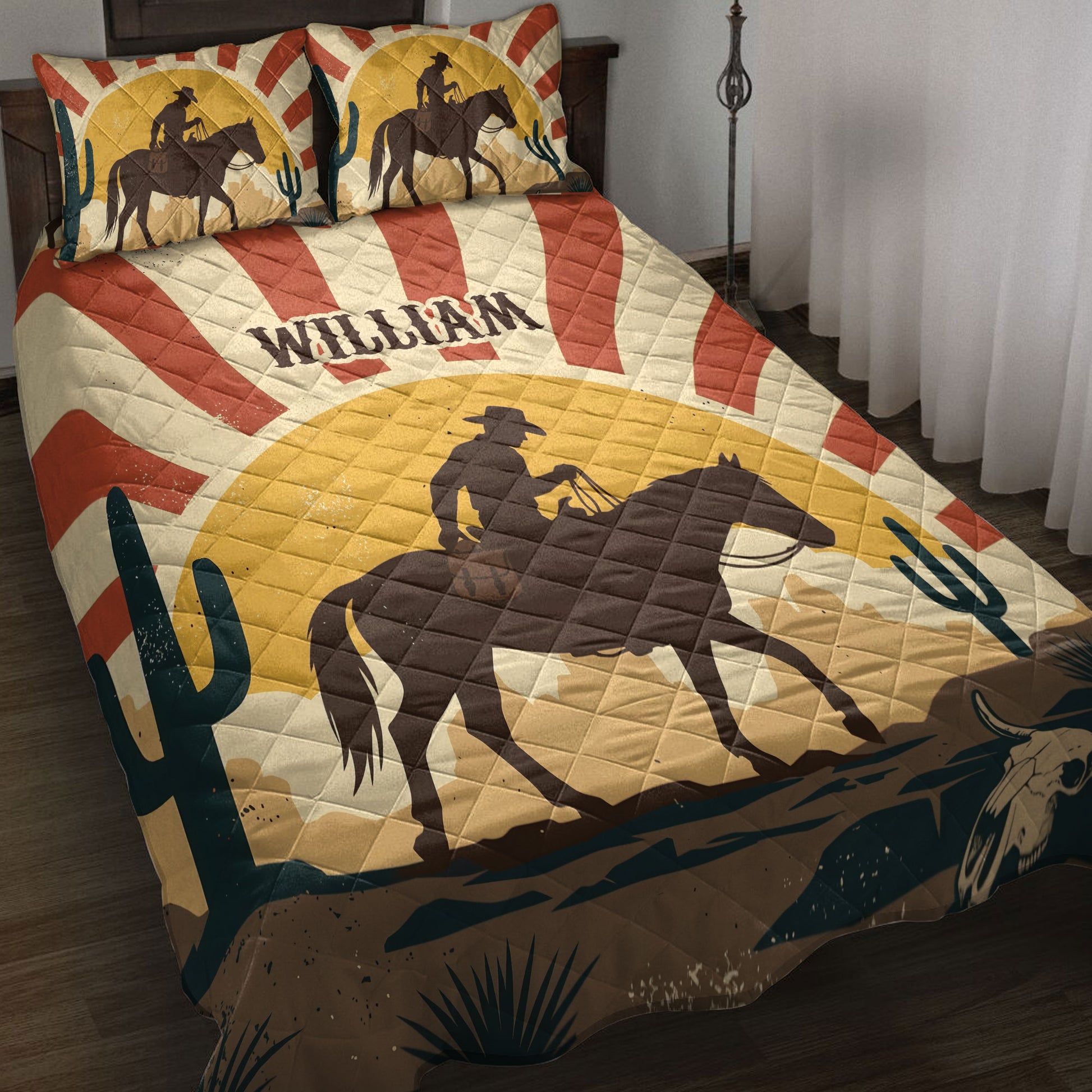 Rodeo quilt blanket spread across a bed with cowboy horseback silhouettes, cacti, and western desert artwork