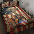 Drum quilt blanket displayed on a bed with patriotic red, white, and blue artwork