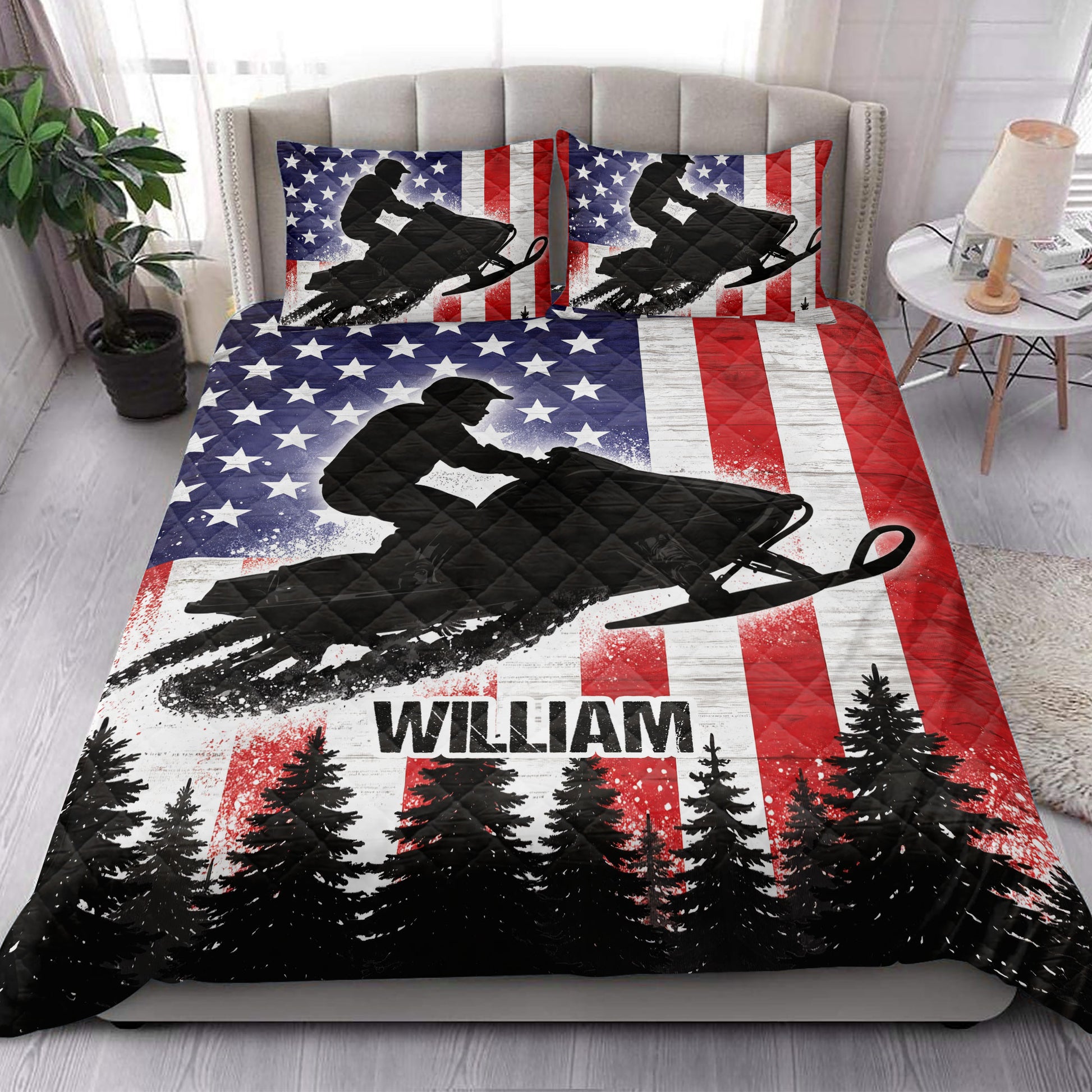 Snowmobile quilt bedding set styled in a bright bedroom with patriotic rider and forest artwork