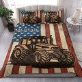 Patriotic tractor quilt blanket styled on a bedroom bed with coordinating tractor artwork