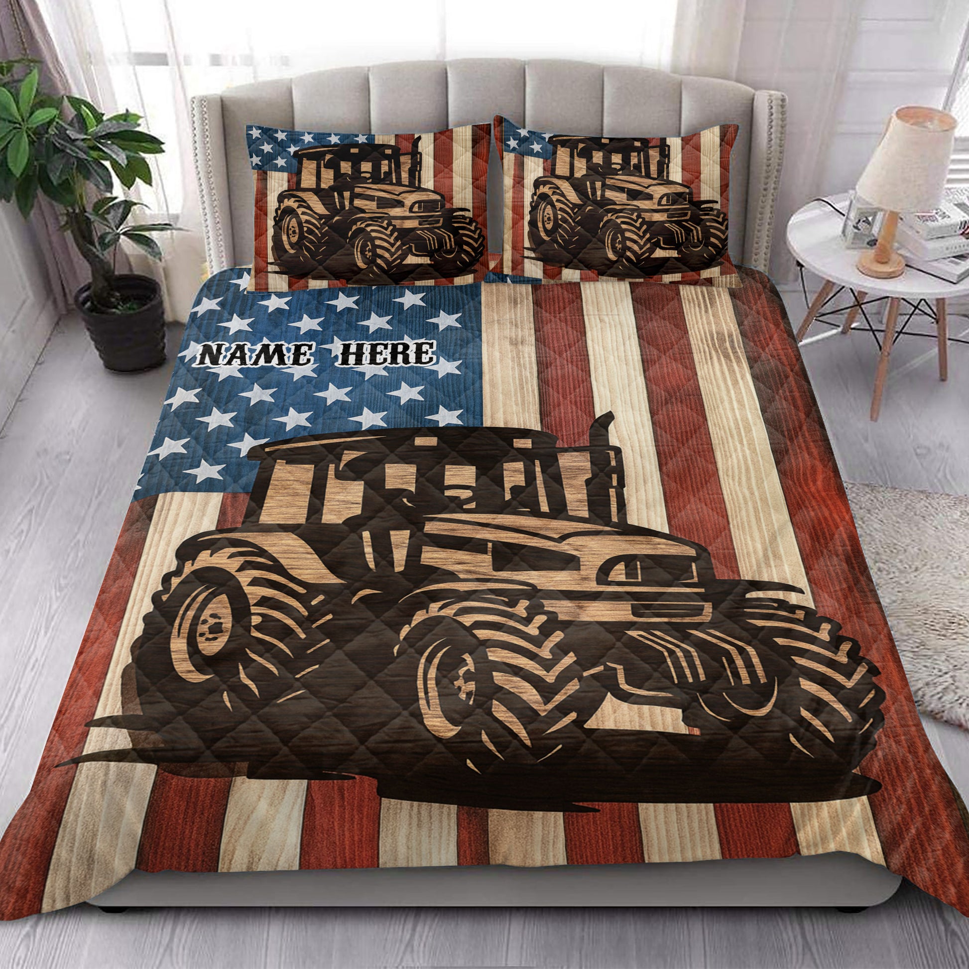 Patriotic tractor quilt blanket styled on a bedroom bed with coordinating tractor artwork