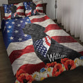 Black Labrador Retriever quilt bedding displayed on a bed with American flag stripes, stars, and colorful flowers