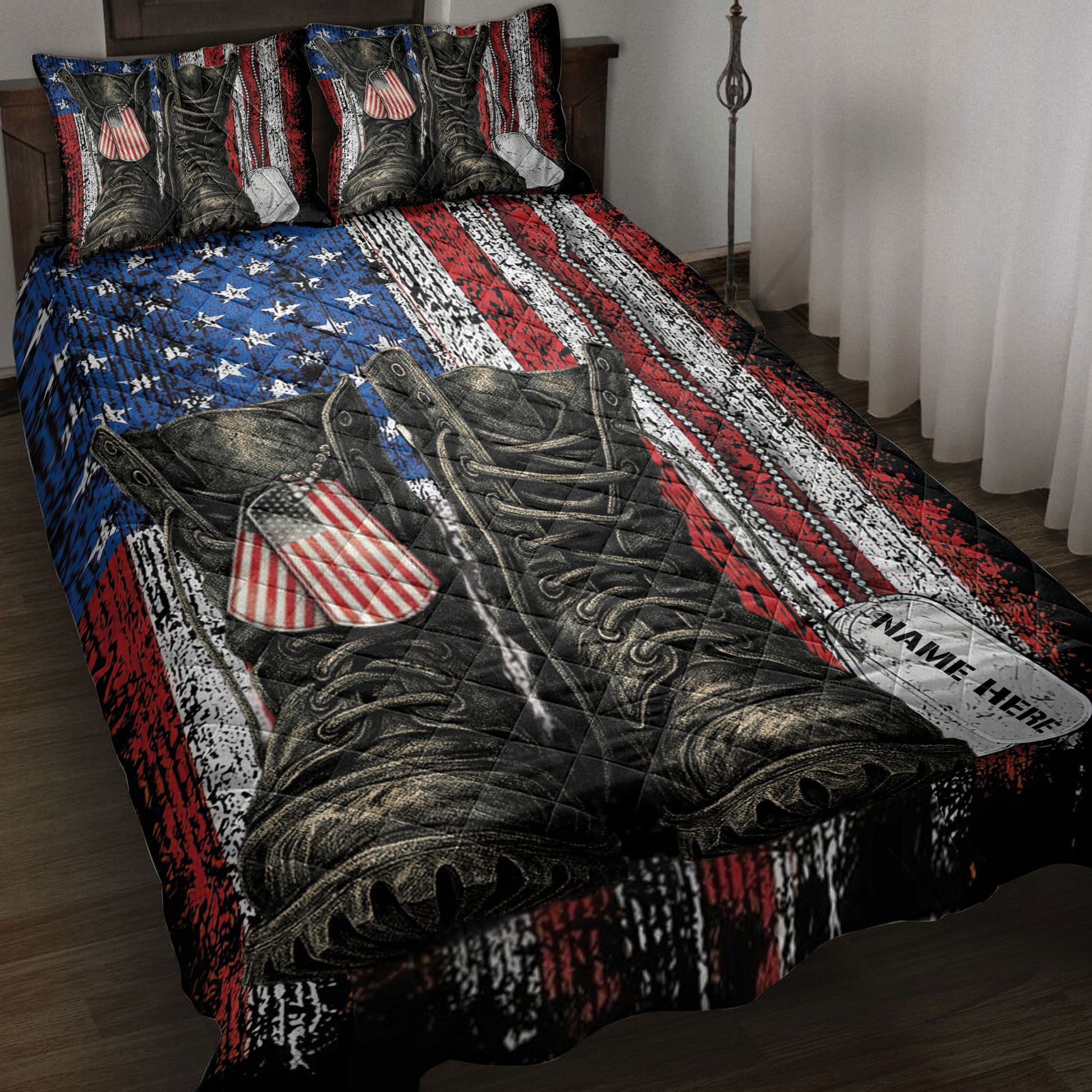 Veteran quilt blanket displayed on a bed with military boots, dog tags, and red, white, and blue patriotic artwork