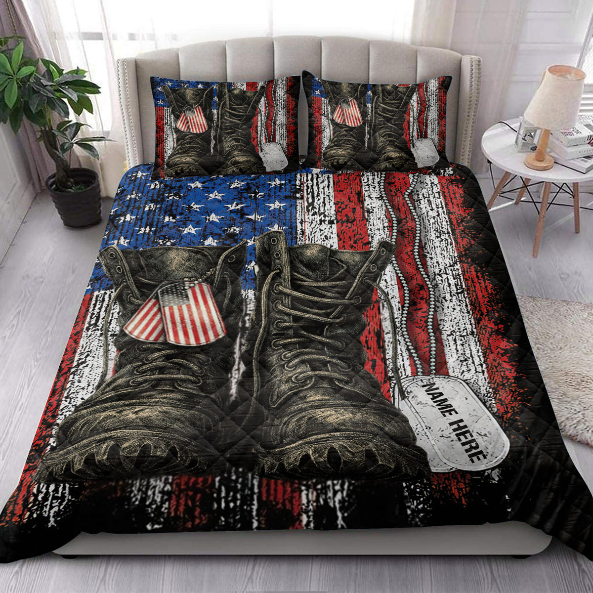 Patriotic veteran quilt blanket styled on a bedroom bed with military boot and dog tag artwork