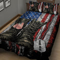 Close view of veteran quilt bedding with military boots, patriotic dog tags, and distressed red, white, and blue stripes