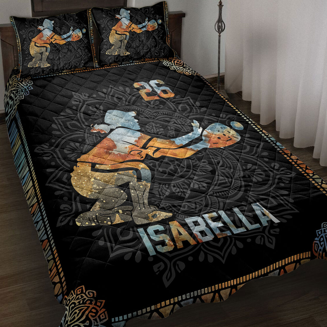 Black softball quilt blanket displayed on a bed with vintage-style batter artwork and colorful geometric borders