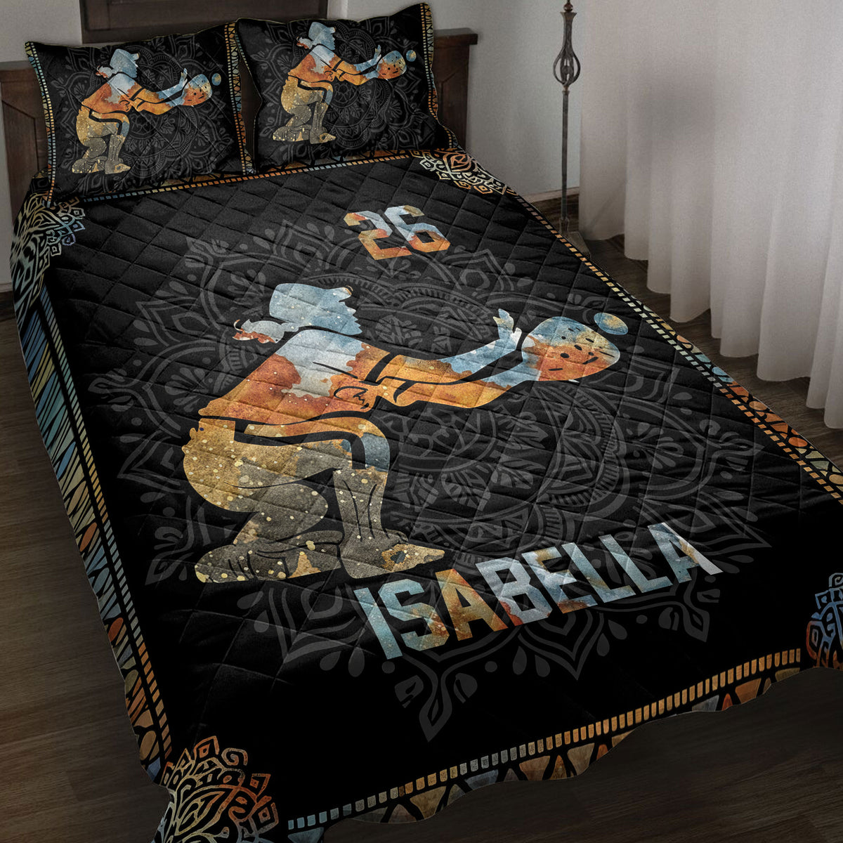 Black softball quilt blanket displayed on a bed with vintage-style batter artwork and colorful geometric borders