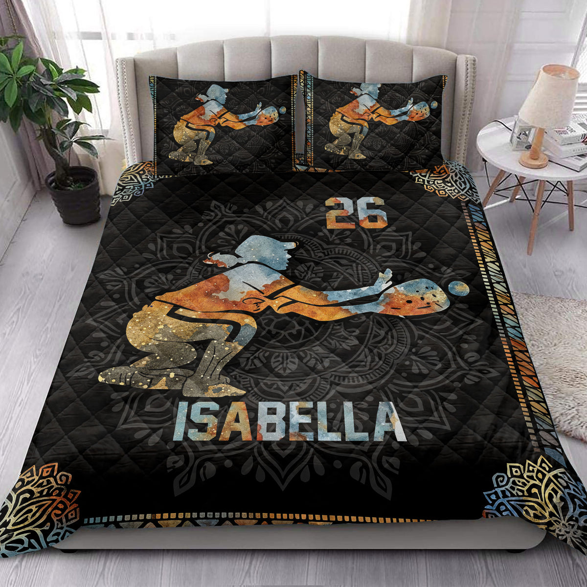 Softball quilt blanket styled in a bright bedroom with dramatic batter artwork and dark athletic decor