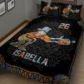 Close bedroom view of a black softball quilt blanket with vintage batter artwork and ornamental borders