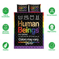 LGBT quilt bedding set shown front-facing with rainbow border, black background, and care icons