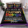 Rainbow LGBT quilt bedding set styled on a modern bedroom bed with coordinating pillows