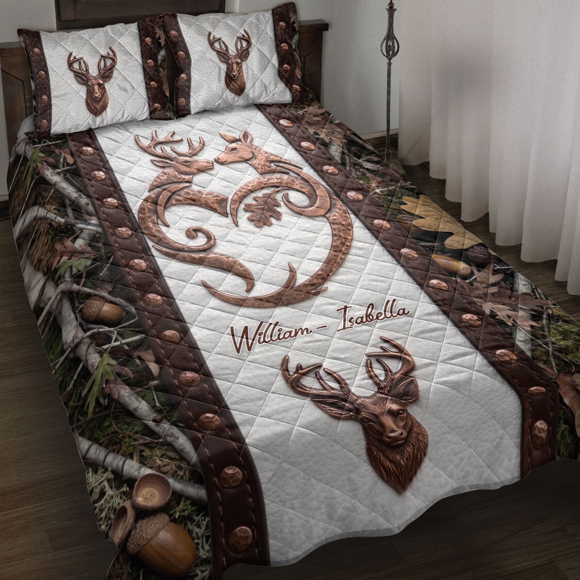 Hunting quilt blanket displayed on a bed with deer artwork, woodland camouflage borders, and antler details