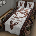 Rustic hunting bedding displayed in a bedroom with deer artwork, woodland camouflage borders, and antler motifs
