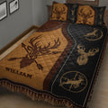 Close-up of a rustic hunting quilt blanket with deer artwork and brown and black geometric borders
