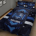 Close bedroom view of police quilt bedding with dark shield design and blue accents